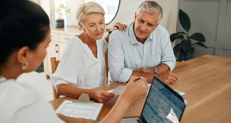 Financial advisor consultation with clients on retirement, finance planning or investment and document on laptop screen